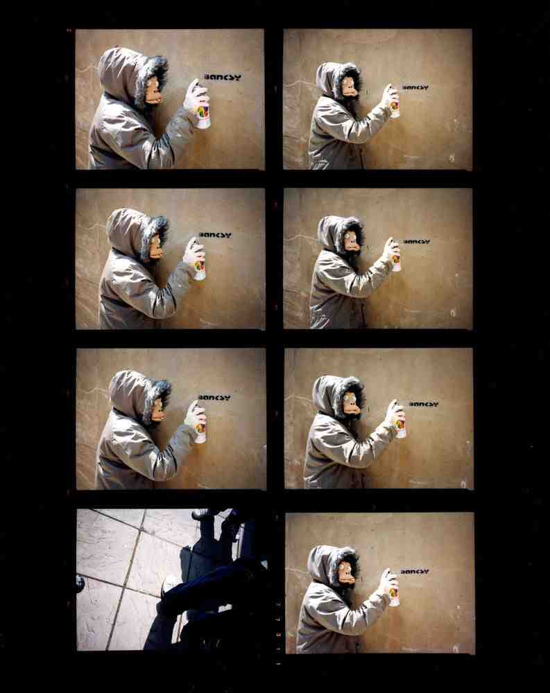 James Pfaff, ‘Banksy, Monkey Mask Session, (Enlarged Contact Sheet), London, 2003’, 2022, Print, Archival Fujicolor C-Type handprint, glossy. (From the original negatives), Self-released, Numbered